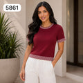 BLUSA EN HILO CON CUELLO REDONDO DE LINEAS